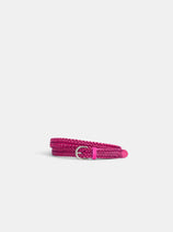 The Dragon Diffusion Woven Leather Belt, featuring a coiled, bright pink braided design and a shiny silver buckle, is displayed on a plain white background.