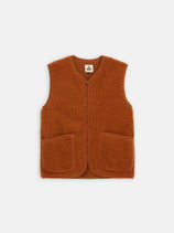 The Coldbreaker Standard Vest is a sleeveless, rust fleece vest with unisex sizing, a front zipper, and two large front pockets, shown on a plain white background.