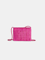 The Dragon Diffusion Pouchette Bali Large Bag is a small, rectangular, bright pink hand-woven crossbody with a long, thin strap, shown against a plain white background.