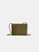 The Dragon Diffusion Pouchette Bali Large Bag is an olive green, hand-woven, rectangular leather bag with a thin braided strap and a simple, natural texture from vegetable-dyed leather, shown against a plain white background.
