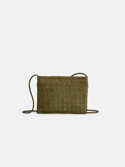 The Dragon Diffusion Pouchette Bali Large Bag is an olive green, hand-woven, rectangular leather bag with a thin braided strap and a simple, natural texture from vegetable-dyed leather, shown against a plain white background.