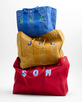 Monogrammed totes in a stack