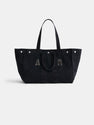 The Painted Perfect Weekend Tote is a spacious black canvas bag with two handles, silver grommets on top, and bold A and R letters displayed on the front.