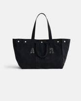 The Perfect Weekend Tote: a large black cotton bag with dual handles, silver rivets on top, and “A R” stitched in front—a stylish monogrammable tote ideal for daily use.