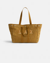 The Perfect Weekend Tote is a spacious brown cotton bag with two handles, silver button accents, and 