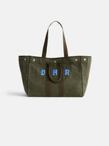 The Perfect Weekend Tote by Alex Mill in large olive-green cotton features brown handles and blue DMR embroidered initials—a top pick for monogrammable bags, shown against a plain white background.
