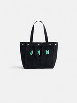 The Perfect Weekday Tote is a black cotton bag with two handles and bold green and white "J M W" letters on the front, shown against a plain white background—ideal for monogram lover’s everyday use.