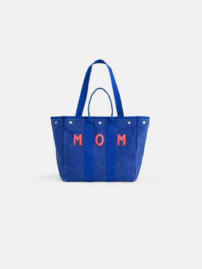 The Perfect Weekday Tote is a blue personalized bag with two handles and "MOM" in red on the front—ideal for anyone seeking a stylish, customizable tote.