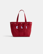 The Perfect Weekday Tote: a red cotton bag with two handles and white and blue 