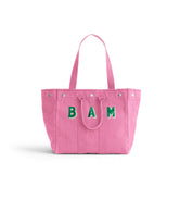 Introducing the Memorial Sloan Kettering Cancer Center × Alex Mill Perfect Weekday Tote—a personalized pink bag featuring two sturdy handles and bold green “BAM” lettering on the front. Set against a plain white background, this standout tote is perfect for supporting breast cancer research or expressing your unique style.