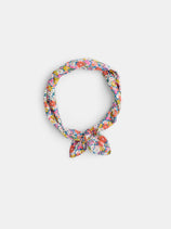 The Alex Mill x Liberty Bandana, featuring a colorful floral pattern from Liberty Fabric and tied in a loose knot, is displayed on a plain white background—a perfect summer accessory.