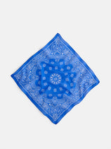 The Two Tone Bandana in Cotton features a white paisley and floral pattern on blue, made from soft cotton voile and displayed flat on a white background, capturing the charm of vintage bandanas.