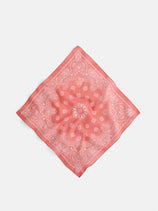 The Two Tone Bandana in Cotton features a pink cotton voile fabric with a white paisley pattern, inspired by vintage styles, and is shown laid flat on a white background.