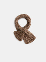 The Bedford Scarf in Cashmere, featuring a chunky knit in brown, is displayed in a neat loop on a plain white background.