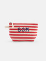 The Painted Perfect Striped Canvas Pouch features red and white horizontal stripes, bold dark blue "SOM" letters on the front, a zipper closure, and a handy fabric loop on one side.