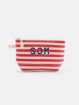 The Perfect Canvas Pouch in Stripe is a small pouch with red and white horizontal stripes, bold SOM letters on the front, and a beige fabric loop on the left side.