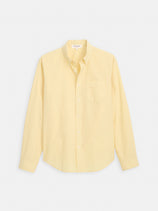 The Mill Shirt in Cotton Poplin is a light yellow, 100% cotton button-down long-sleeve shirt with a front chest pocket, shown laid flat on a white background.