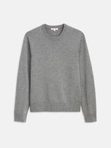 The Reverse Seam Crew In Wool Cotton is a lightweight, long-sleeved crewneck sweater in light gray with ribbed cuffs, hem, and neckline, shown laid flat on a white background for a classic look.