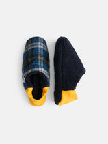 Shaggy Tartan House Shoes: one features a blue, green, and yellow plaid design; the other is solid navy with a fuzzy texture. Both slippers have bright yellow cuffs and are machine washable. Shown on a white background.