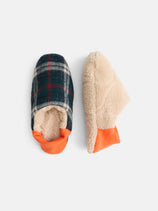 The Shaggy Tartan House Shoes: cozy, machine washable slippers—one in green/navy plaid with orange trim, the other showing a fuzzy beige sole and orange heel—both inspired by classic Japanese house shoes on a white background.