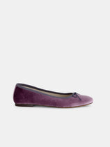 The Prince Street Ballet Flat in Velvet is shown in profile—a single purple velvet flat with a small bow on the toe, elegantly displayed against a plain white background and perfect for any handmade ballet flat collection.