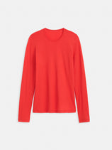 The Airspun Tee in Cotton, a long-sleeved red women's top, is laid flat on a white background and crafted from soft fabric for everyday comfort.