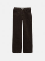 The Camden Pant In Corduroy is a women's relaxed fit, straight leg pant in dark brown cotton corduroy, featuring front and back pockets, button closure, and belt loops, shown laid flat on a white background.