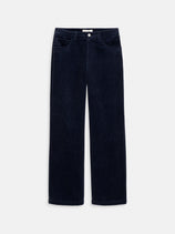 The Camden Pant In Corduroy is a women's relaxed fit, straight leg cotton corduroy pant in dark navy blue with front and back pockets, button closure, and belt loops, shown laid flat on a white background.