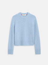 The Marais Crewneck Sweater in Cashmere is a light blue, long-sleeve sweater with ribbed cuffs, hem, and neckline. Crafted from soft cashmere, it features a classic crew neck and is shown flat on a white background.