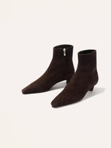 The Alex Mill x Margaux: The Inga - Espresso Suede features dark brown Italian suede ankle boots with pointed toes, low kitten heels, and side zippers, shown against an off-white background.